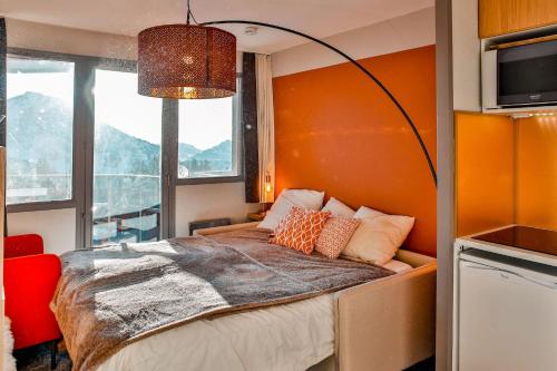 Ένα ή περισσότερα κρεβάτια σε δωμάτιο στο IMMODREAMS - Le Choucas - Avoriaz