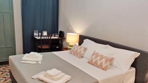Postel nebo postele na pokoji v ubytování Borgo Antico Rooms