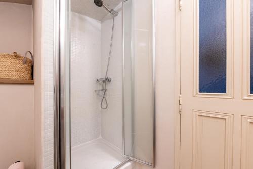 a shower with a glass door in a bathroom at Bed end breakfast du centre in Bourg-Saint-Maurice