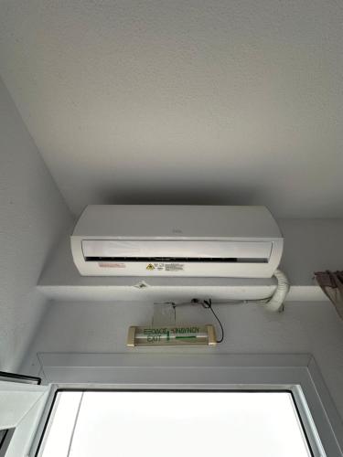 a dvd player sitting on top of a ceiling at Dimos apartments in Kókkinon Nerón