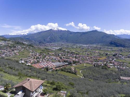 an aerial view of a city with mountains in the background at Albergo Deva in Riva del Garda