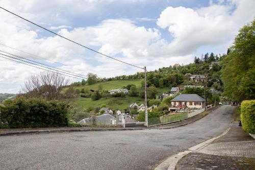 an empty street in a small village with houses at Studio avec Jardin à Bagneres in Bagnères-de-Bigorre