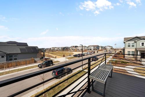 a balcony with a bench and a street at Orleans Street - Aurora in Aurora