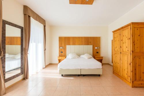 Letto o letti in una camera di Agritur Eden Marone
