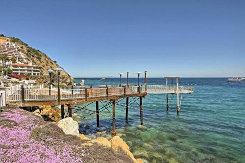 a pier in the water next to the ocean at Ocean View Hamilton Cove Villa in Avalon