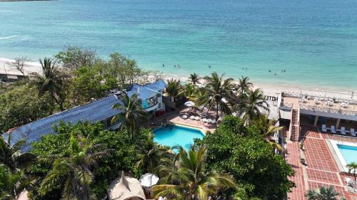 a view of the beach from the balcony of a resort at Hotel Tropical Inn in Tierra Bomba