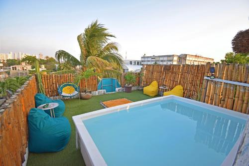 Bazén v ubytování Bungalow Maya en CASA NOMIS CANCUN nebo v jeho okolí