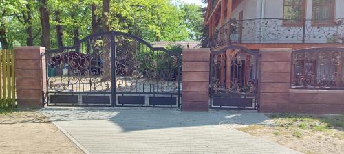 an iron gate in front of a house at la Brigitte in Hennigsdorf
