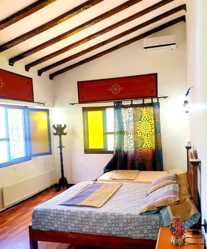 a bedroom with a bed in a room at Dar Casa Plasa Grande in Chefchaouene