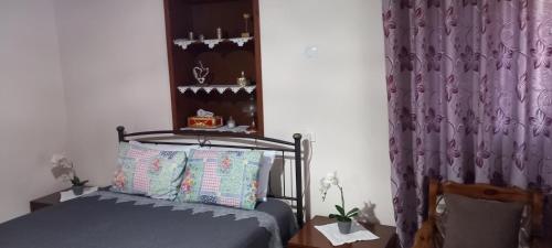 Ένα ή περισσότερα κρεβάτια σε δωμάτιο στο Grand Anny's Home