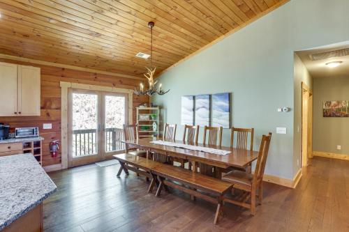a dining room with a wooden table and chairs at Family Cabin with Private Hot Tub and Views in Boone! in Boone