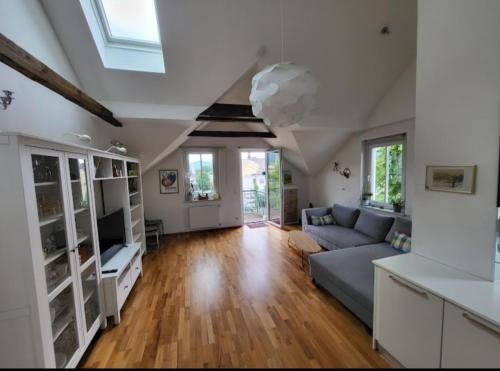 a living room with a couch and a table at Apartment Barbara in Velden am Wörthersee