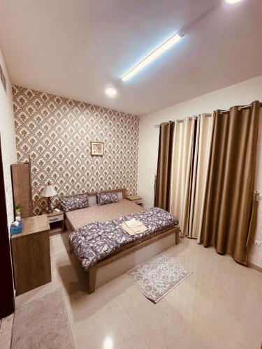 a bedroom with two beds in a room at Beautiful home in Ajman 
