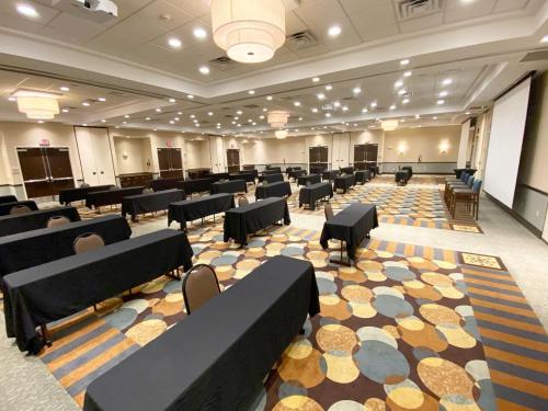 a large room with rows of chairs and tables at Hilton Garden Inn Sioux Falls South in Sioux Falls
