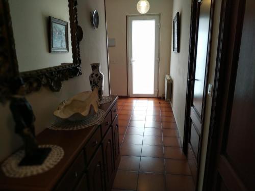 a hallway with a door leading to a room with a tile floor at Villa Sara in Ribadeo