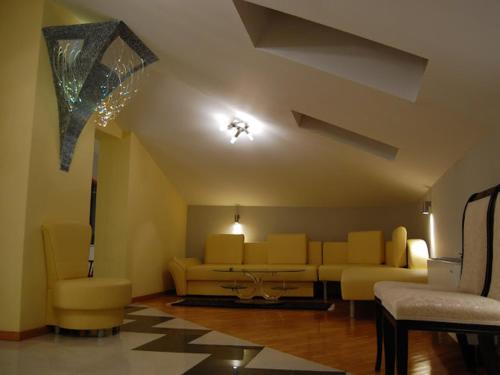 a living room with a couch and a table at Petrovski's Residence in Bitola