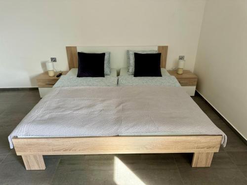 two twin beds in a room with two tables at Byt apartman 73m2 for 4people ALL NEW! 2023 in Prague