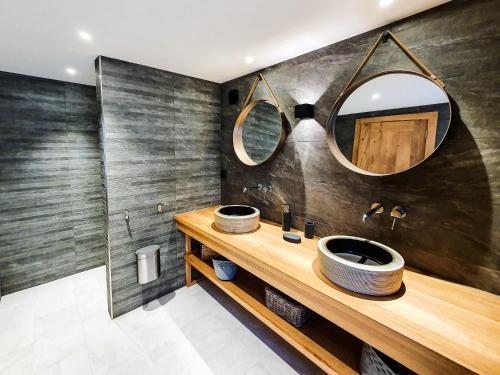 a bathroom with a sink and a mirror at Les Fermes de Cal Panche : La Ferme in Les Angles