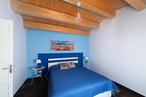 Letto o letti in una camera di Palazzo Marchese Milo