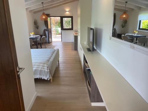 a bedroom with a bed and a television in a room at Studio Vitalis in Rovinj