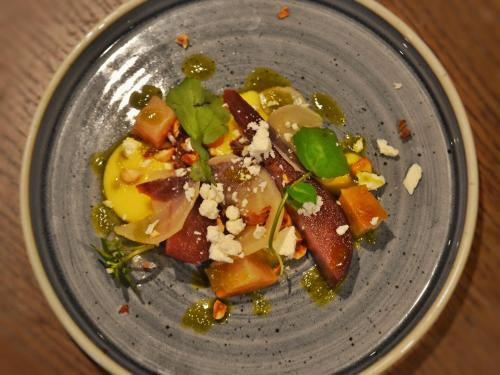 a plate of food with fruits and vegetables on a table at Red Lion Inn in Hawkshead