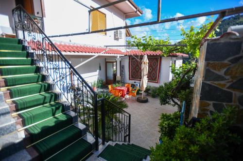 a view of a house with stairs and a patio at Rezidenca Aurel Center in Berat