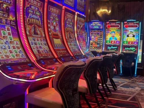 a row of slot machines in a casino at Rocksino by Hard Rock Deadwood in Deadwood