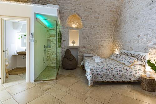 Postel nebo postele na pokoji v ubytování Luxury Suite Of Ostuni