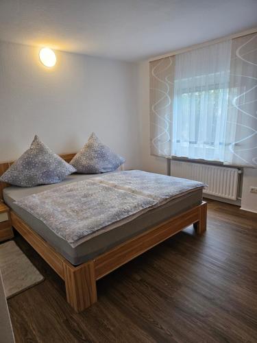 a bedroom with a large bed in a room at Ferienwohnung Medina in Bad Wildungen