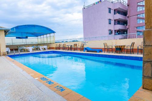 a large swimming pool on top of a building at Paleo Hotel and Spa in Thika