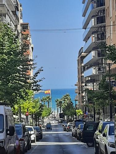 a city street with cars parked on the side of the road at Calpe Perlamar in Calpe