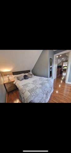 a bedroom with a large bed in a room at Woodland lodge, apartment in Derry Londonderry