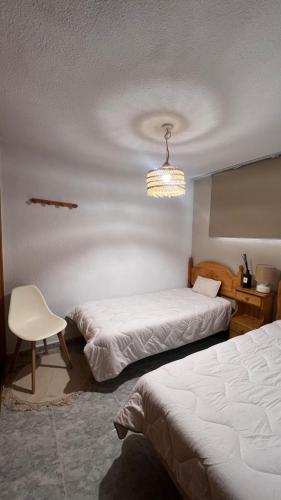 Un pat sau paturi într-o cameră la Apartamento Pedro