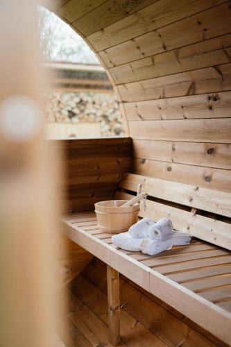 a sauna with two white towels sitting on a shelf at Raschbrunnenhof - Ökolandbau & Erholung in Haunsheim