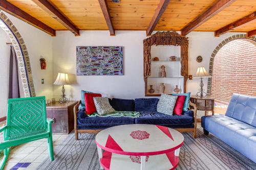 a living room with a couch and a table at Rosarito Beach Home in Las Gaviotas with Ocean Views in Raulis