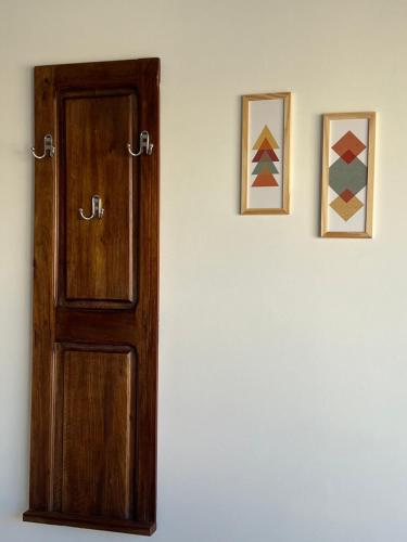 a door in a room with two pictures on the wall at MAO Buenos Aires - Apt. en Recoleta in Buenos Aires