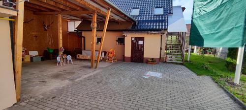 an empty courtyard of a house with a table and chairs at U Martuly in Ružomberok