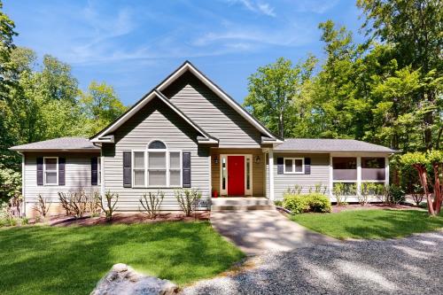 a house with a red door at Secluded Serenity in Bumpass