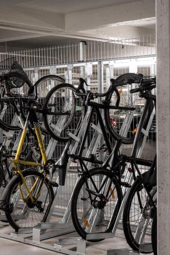 a bunch of bikes parked in a garage at The Pier apartments by Daniel&Jacob's in Copenhagen