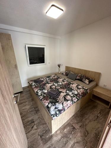 a bedroom with a large bed in a room at Terra Solis Bihać Villa 1 in Bihać