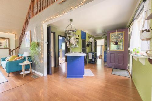 a living room with a couch and a table in a room at Ancient Oak Sanctuary Rural getaway, walking paths in Grand Junction
