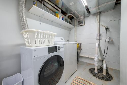 a washer and dryer in a small room at Ancient Oak Sanctuary Rural getaway, walking paths in Grand Junction