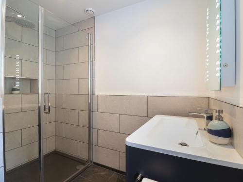 a bathroom with a sink and a shower at The Hideaway in Lyme Regis