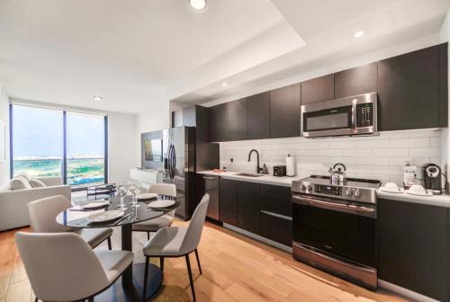 a kitchen with a table and chairs in a room at Apartment Offering Direct Bay Views in Miami