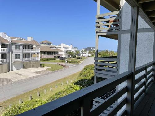 a view of a street from the balcony of a house at Lighthouse Point Rental 8B in Tybee Island