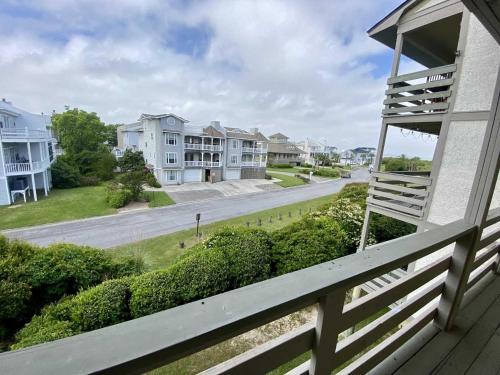 a view of a street from a porch of a house at Lighthouse Point Rental 8B in Tybee Island