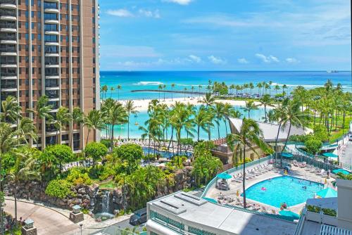 an aerial view of a resort with a pool and the ocean at Ilikai Tower 1314 Lagoon View 1BR in Honolulu