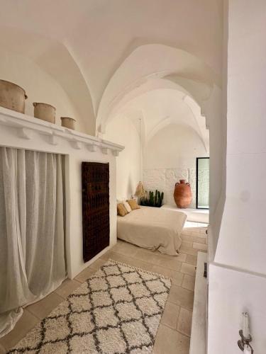 Ένα ή περισσότερα κρεβάτια σε δωμάτιο στο Riad Salentino by Acqua di Puglia