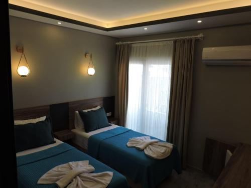 Кровать или кровати в номере Basar hotel