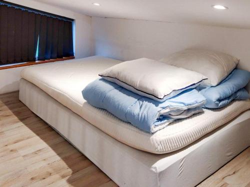 Ένα ή περισσότερα κρεβάτια σε δωμάτιο στο 4 person holiday home in GLOMMEN-By Traum